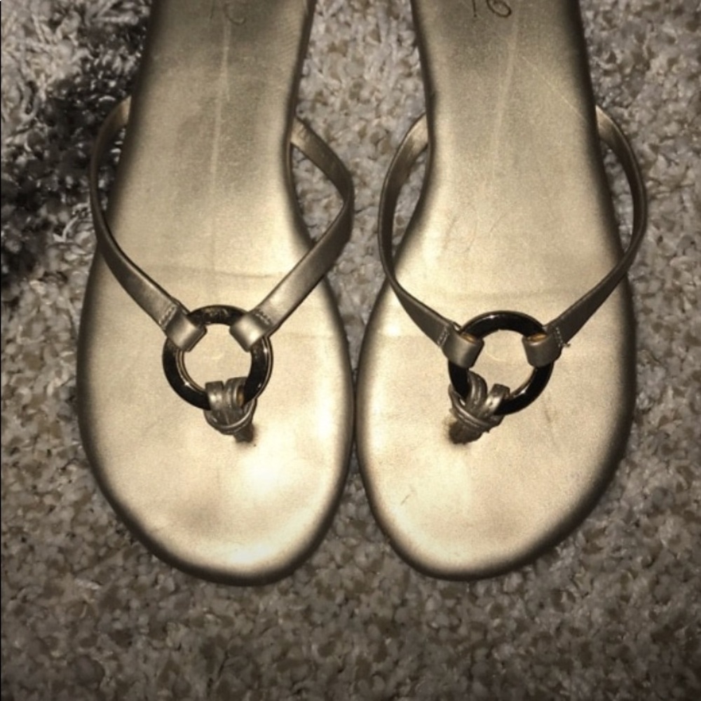 Gold sandals, with gold ring for decoration.